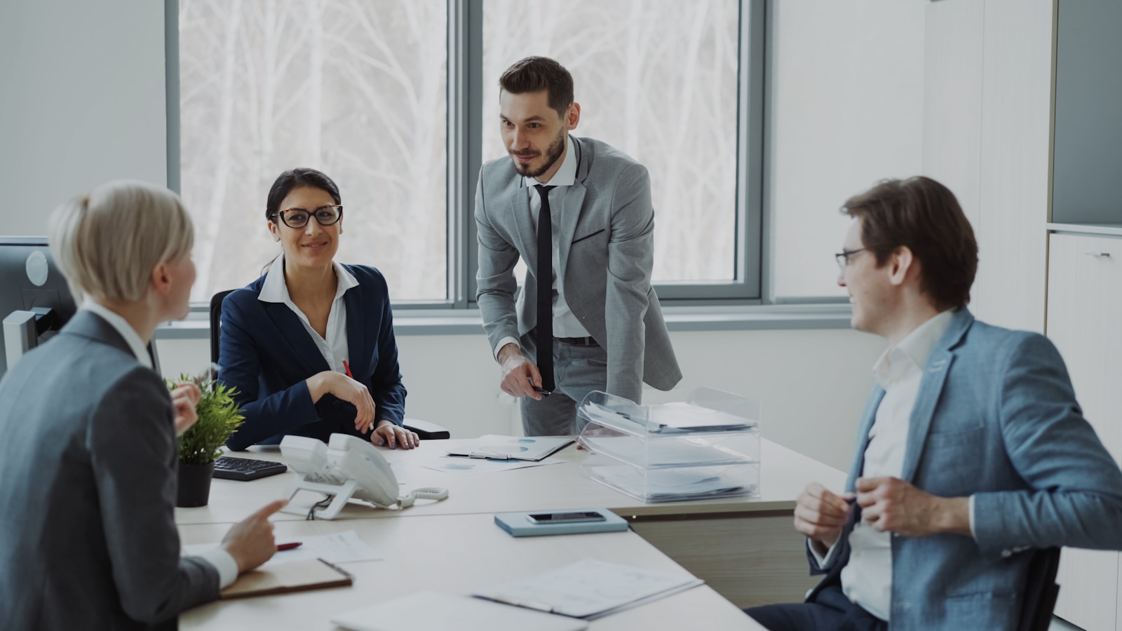 Business professionals collaborating around a conference table.
